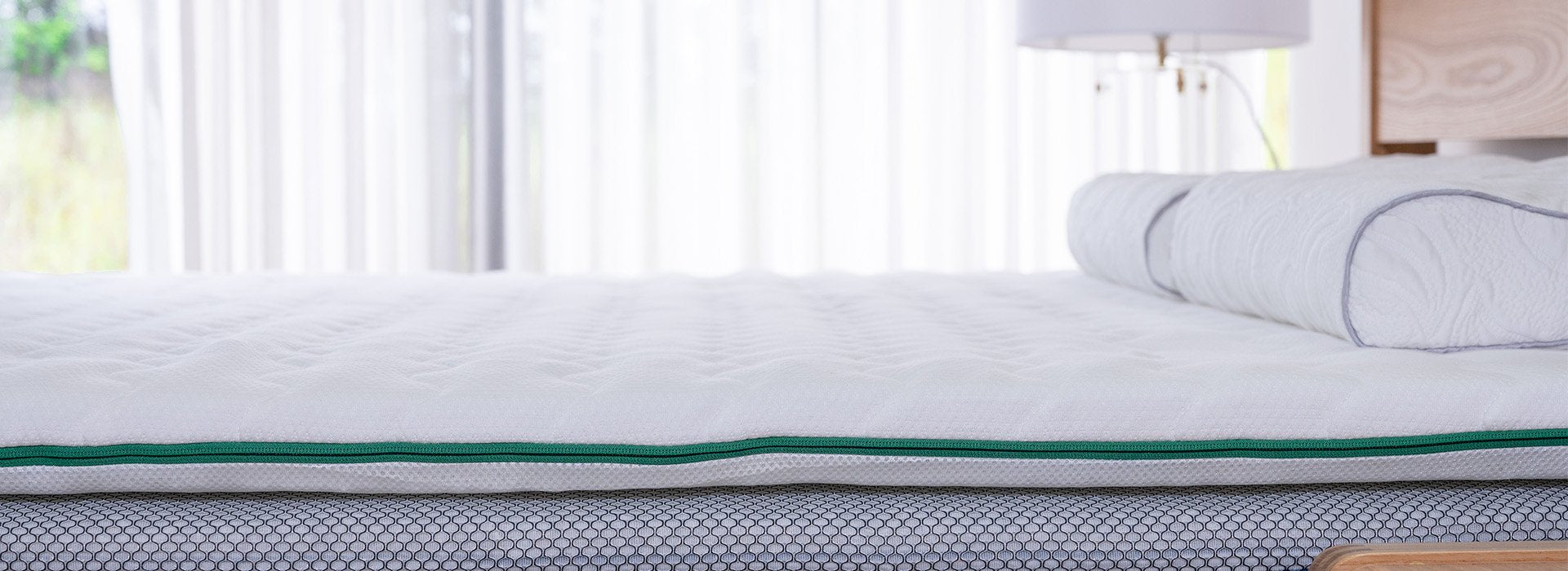 Side view of a Fullair Top Mattress on a bed.