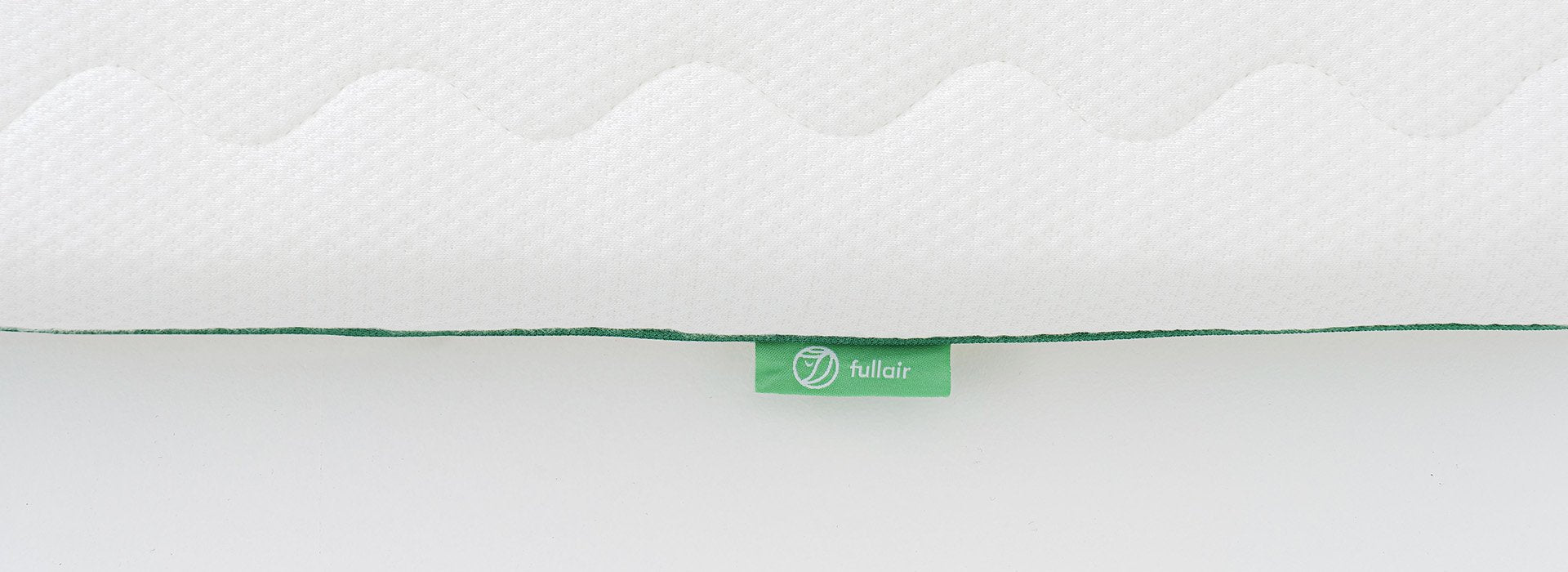Close-up of Fullair Top Mattress tag.